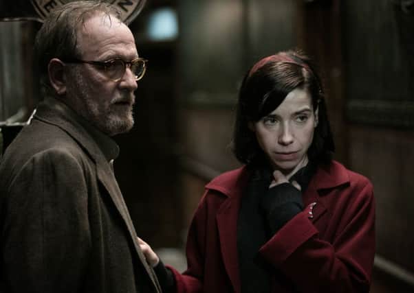 MONSTER MOVIE: Richard Jenkins as Giles and Sally Hawkins as Elisa Esposito in The Shape of Water.