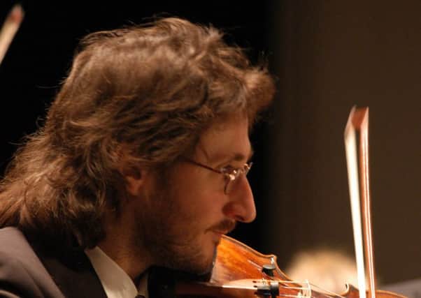 MUSICAL DIRECTOR: Violinist Hans-Peter Hofmann leads the orchestra.