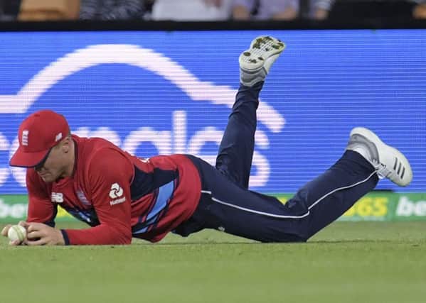 England's Jason Roy is judged to not have caught a ball that would have Australia's Glenn Maxwell out during their Twenty/20 cricket match in Hobart. (Tracey Nearmy/AAP Image via AP)