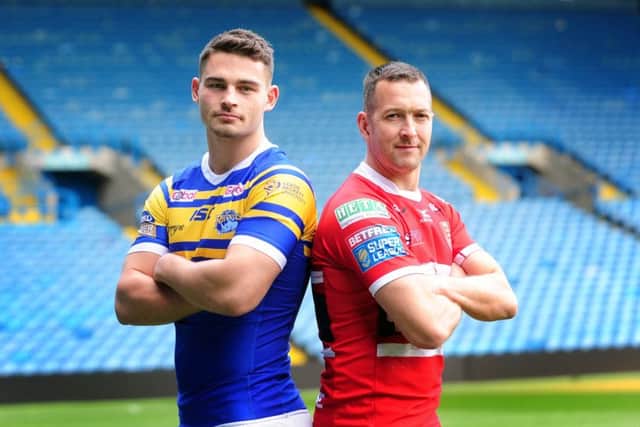 Rhinos player Stevie Ward is pictured with Hull KR's Danny McGuire.