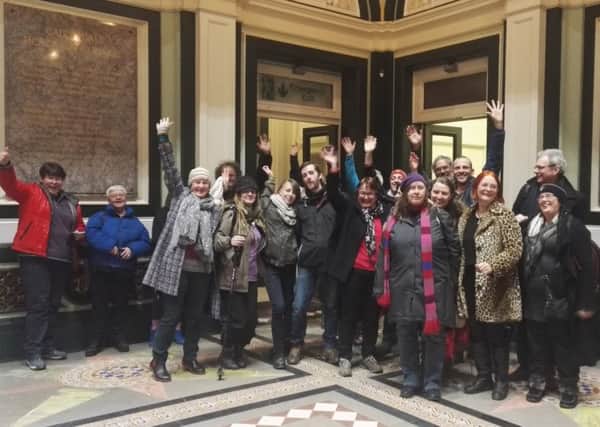 Celebration: TLC campaigners learn that councillors have backed the transfer option