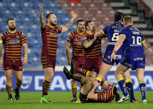 Huddersfield Giants Danny Brough and Warrington's Chris Hill confront each other (Picture: Richard Sellers/PA Wire).