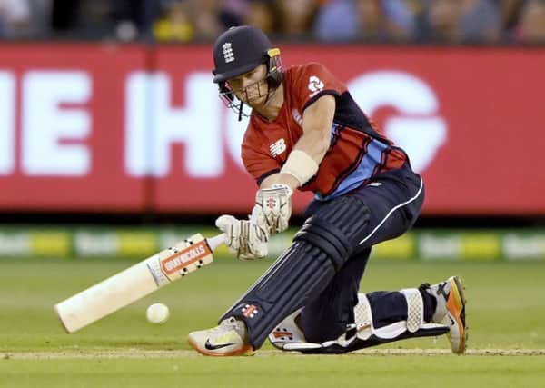 England's Sam Billings sweeps the ball against Australia