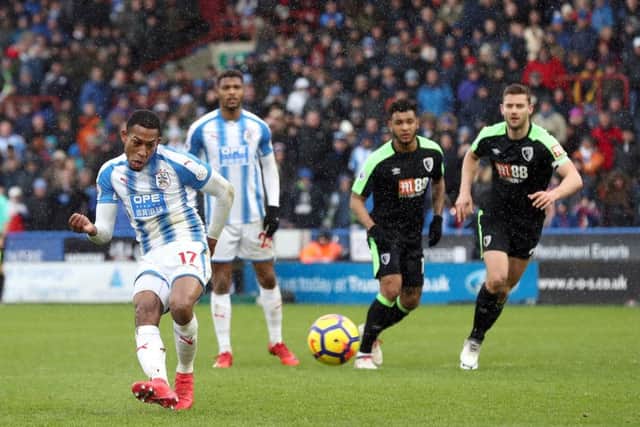 Huddersfield Town's Rajiv van La Parra scores a late penalty, his side's fourth goal. Picture: Martin Rickett/PA