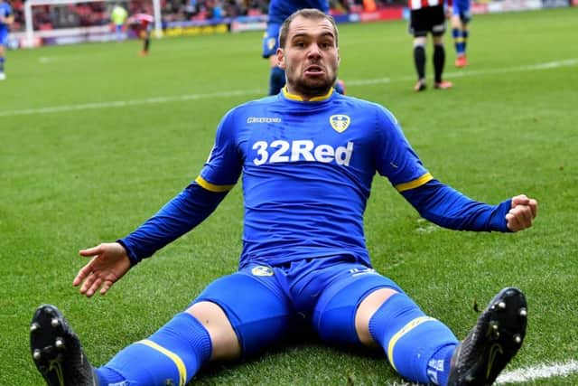 Pierre-Michel Lasogga is delighted after pulling Leeds United level but Billy Sharp had the final and decisive say with his penalty for Sheffield United (Picture: Jonathan Gawthorpe).