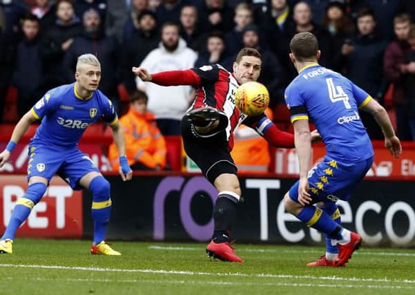 Sheffield United's Billy Sharp gives his side an early lead against Leeds United with a stunning volley (Picture: Simon Bellis/Sportimage).