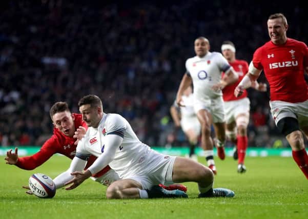 England's Jonny May scores his side's first try of the game against Wales.