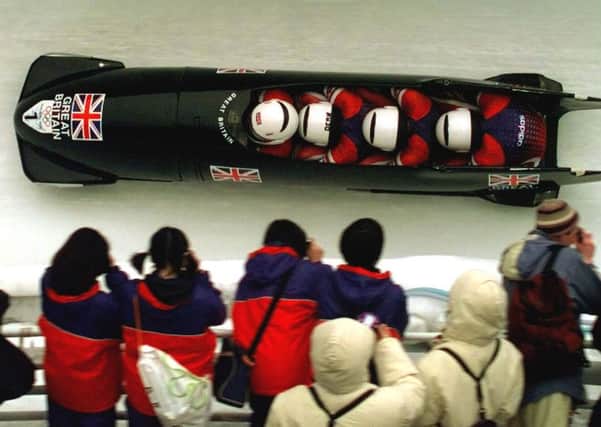 Sean Olsson drives the GB 1 team through the heats at Nagano Winter Olympics in 1998, the team eventually winning a historic bronze medal. Picture: AP/David J. Phillip
