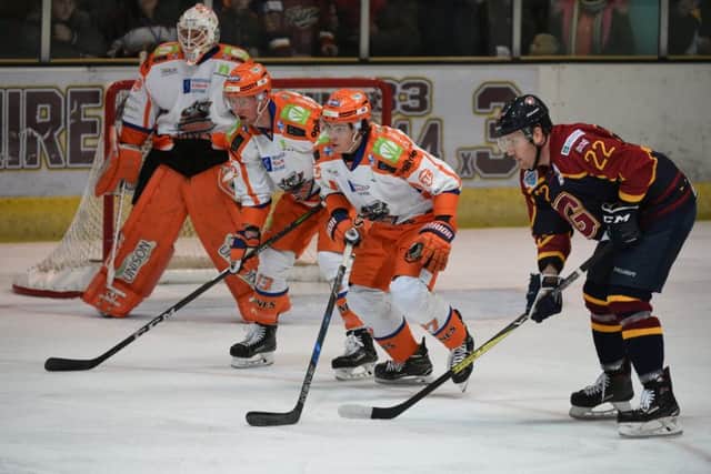 TOUGH GOING: Sheffield Steelers' Cole Shudra and David Phillips try to break down a Guildford attack. Picture: John Uwins/EIHL.