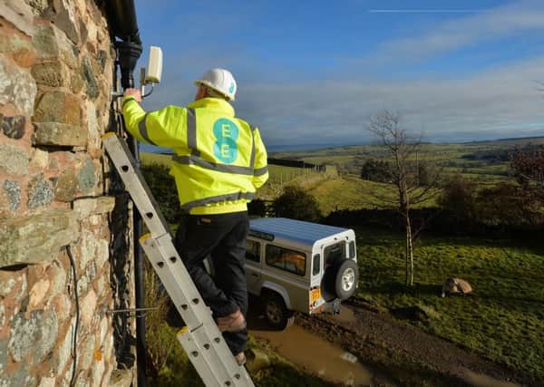 An EE engineer installs a 4G antenna to a home in the Cumbrian North Fells. Picture by Mark Runnacles/PA Wire