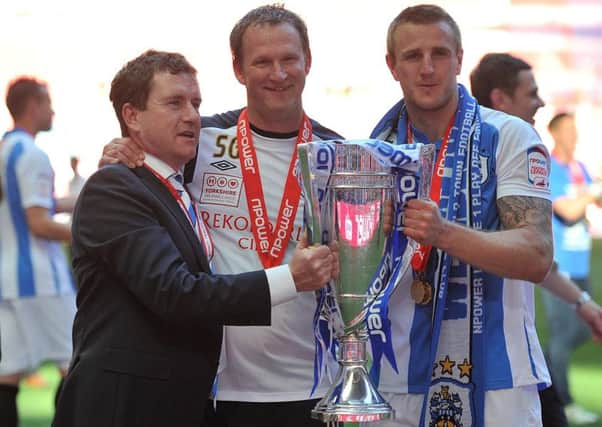 New Bradford City manager Simon Grayson, centre, then boss of Huddersfield Town, pictured with the clubs chairman Dean Hoyle and captain Peter Clarke after their League One play-off final penalty shootout win over Sheffield United in May 2012 (Picture: Martin Rickett/PA Wire).