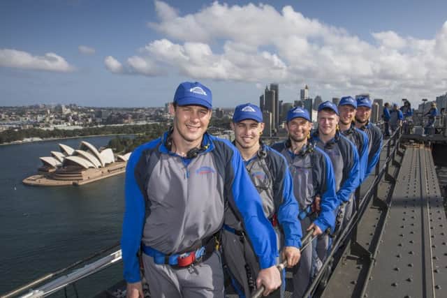 Wigan Warriors and Hull FC players and The Yorkshire Post's Dave Craven, third left, experience the Sydney Bridge climb (Picture: Dallas Kilponen).