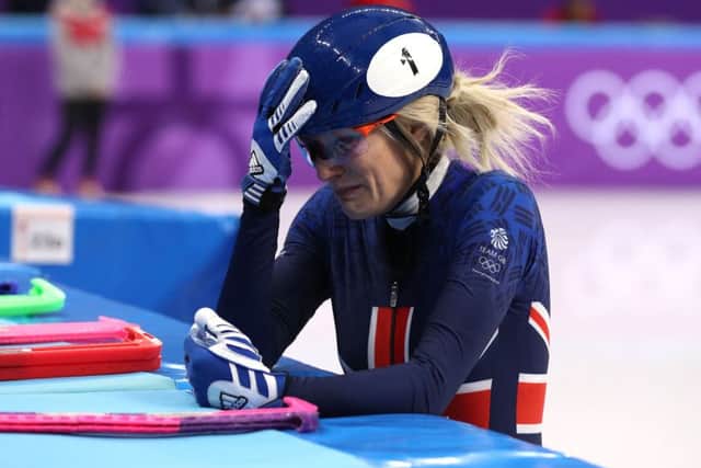 Great Britain's Elise Christie appears dejected her crash
