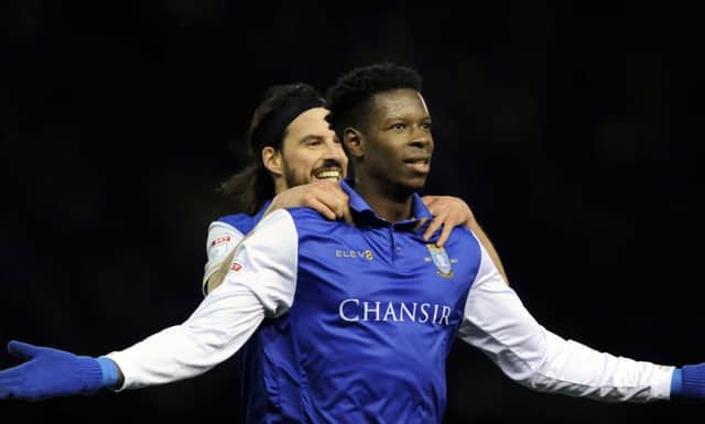 Lucas Joao is congratulated by George Boyd after scoring the first of his two goals for Sheffield Wednesday against Derby County (Picture: Steve Ellis).