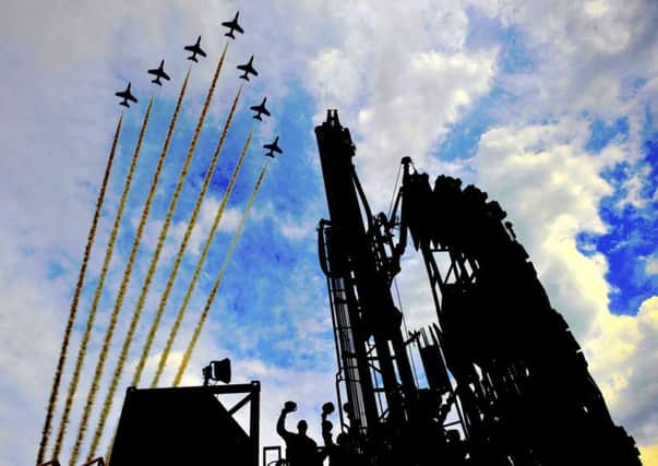 Red Arrows fly over the Sirius drilling rig on the North York Moors