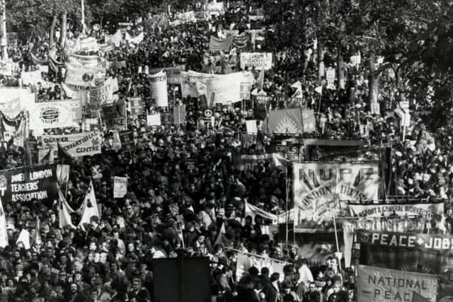 Demonstrators march on Hyde park for one of Britain's largest CND rallies in 1983. (PA).