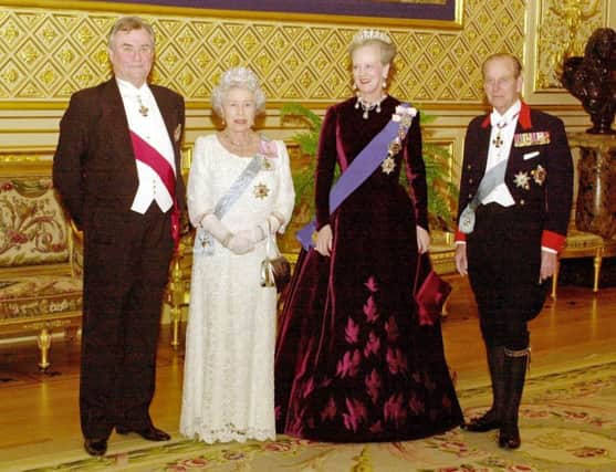 Prince Henrik of Denmark, Queen Elizabeth II, Queen Margrethe of Denmark and the Duke of Edinburgh before a state banquet at St George's Hall in Windsor Castle.