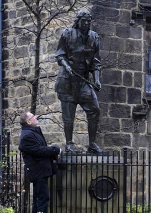 Lawrence Ross with the statue of Thomas Chippendale in Otley