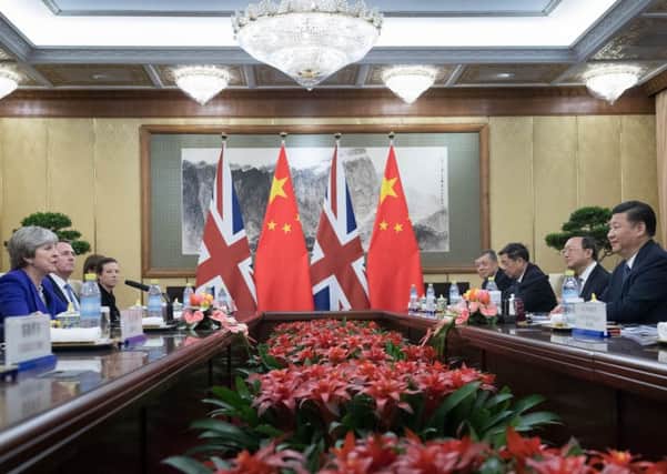 Prime Minister Theresa May meets with Chinese President Xi Jinping at the Diaoyutai State Guest House in Beijing today during her visit to China.  PRESS ASSOCIATION Photo. Picture date: Thursday February 1, 2018. The prime minister accompanied by a business delegation is on a three day visit to China to encourage post-Brexit investment in the UK. See PA story POLITICS China. Photo credit should read: Stefan Rousseau/PA Wire
