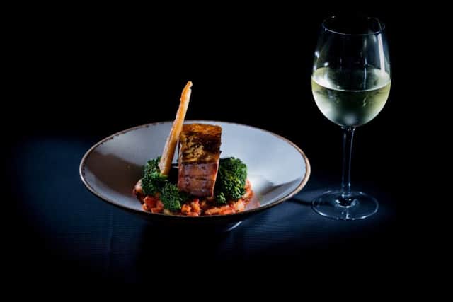 Slow roast pork belly, chorizo & butterbean mash cassoulet, curley kale. Picture by James Hardisty.