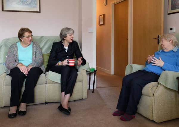 Theresa May during a visit to a London housing estate when she promised to put the issue at the top of the political agenda.