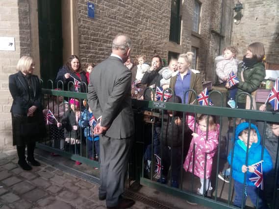 Prince Charles chats to children and staff at Totspot Day Nursery, Halifax.