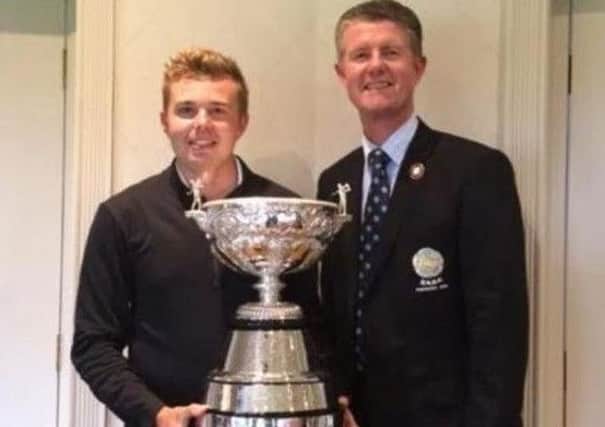 Ben Hutchinson receives the Yorkshire amateur championship trophy for 2016 from then YUGC president Jonathan Plaxton after his victory at Moortown.