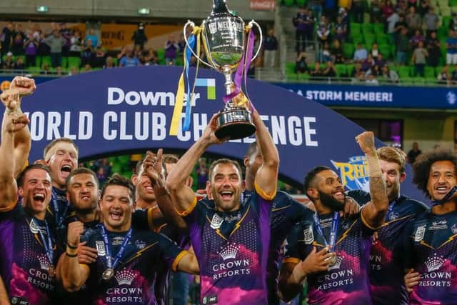 Victorious Melbourne storm celebrate and lift the trophy. Picture: Brendon Ratnayake/SWpix.com