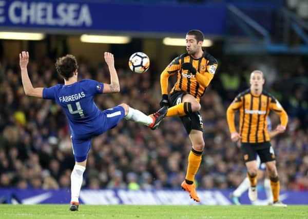 Chelseas Cesc Fabregas, left, stretches in an attempt to halt Hull Citys Evandro Goebel during last nights FA Cup fifth-round tie (Picture: Adam Davy/PA Wire).