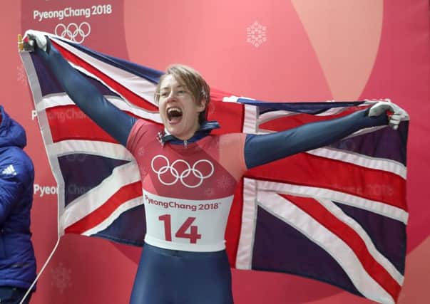 Great Britain's Lizzy Yarnold celebrates winning gold in the Women's Skeleton at the Alpensia Sliding Centre.