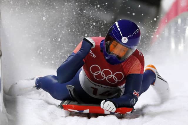 Lizzy Yarnold of Britain celebrates her gold medal winning run.