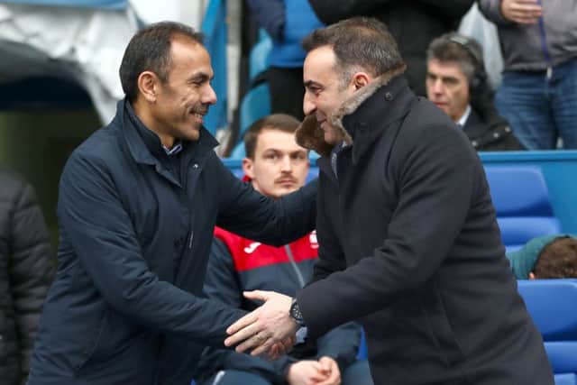 Old meets new: Swansea City manager Carlos Carvalhal (right) and Sheffield Wednesday manager Jos Luhukay shake hands.