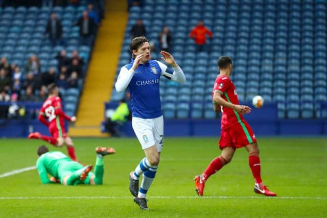 Sheffield Wednesday's Adam Reach rues a missed chance.
