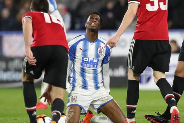 Huddersfield Town's Terence Kongolo reacts during the Emirates FA Cup, Fifth Round match at The John Smith's Stadium.