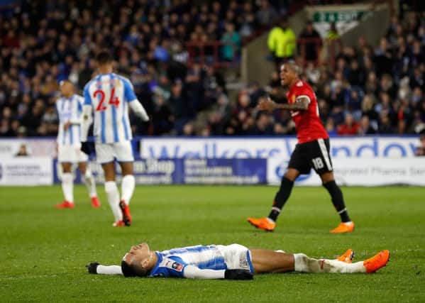 Huddersfield Town's Tom Ince looks dejected after missing a chance to score.