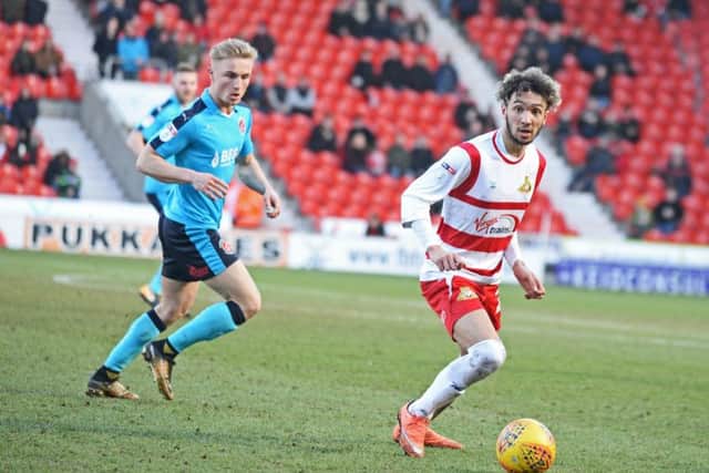 Baxck in action: Doncaster Rovers' Alex Kiwomya.
