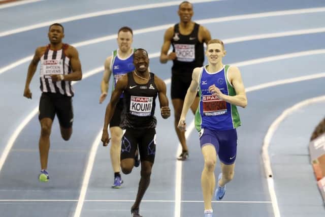 Lee Thompson (right) wins the Men's 400m final.