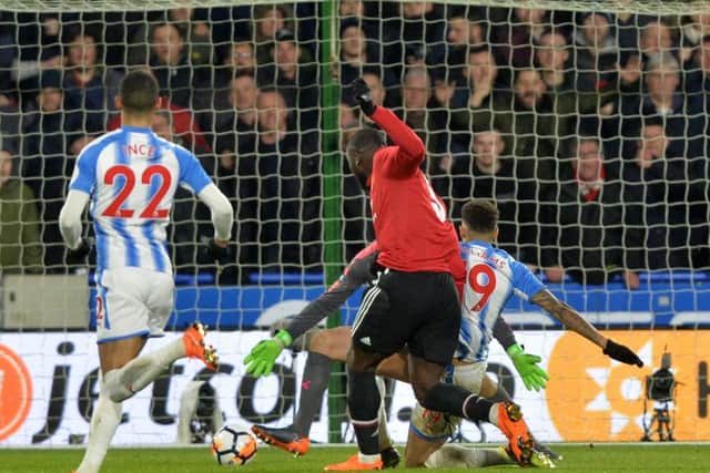 Romelu Lukaku scores his second goal for Manchester United against 
Huddersfield Town. (Picture: Bruce Rollinson)