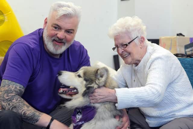 Adrian Ashworth and his specially trained 'dementia dogs' at Barnsley Day Centre's dementia group.Picture Scott Merrylees