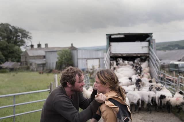 Ruth Wilson, Mark Stanley and sheep in Dark River.