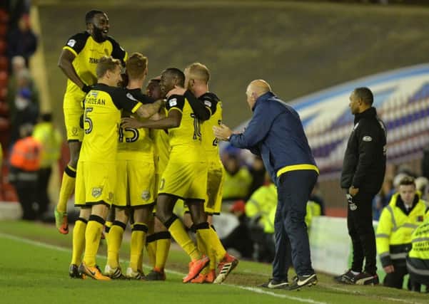 Burton Albion celebrate their second goal scored by Jacob Davenport.   Picture Bruce Rollinson