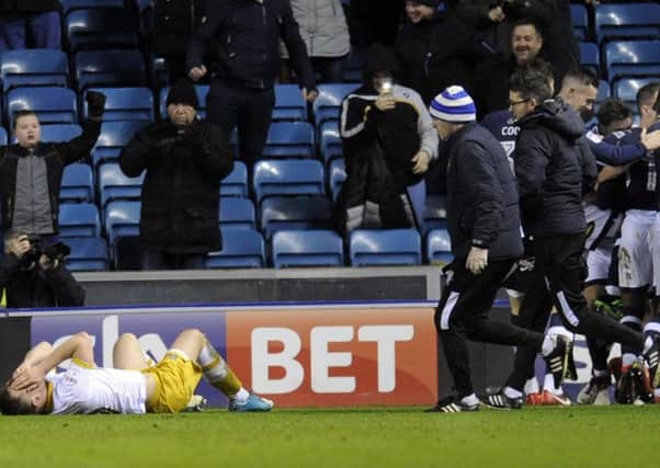 Jordan Thorniley lies down injured after a collision in the build-up to Millwall's second goal (Picture: Steve Ellis)