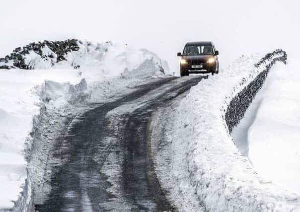 Cars struggling on Fleet Moss, North Yorkshire's highest road, in January.  Picture: PA