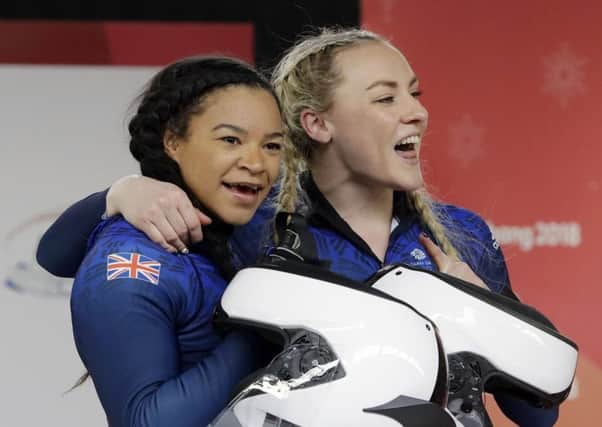 Driver Mica McNeill and Mica Moore of Britain smile after their final heat during the women's two-man bobsled final in PyeongChang. Picture: AP/Michael Sohn