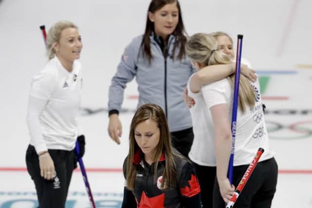 Canada's skip Rachel Homan, center, leaves the ice after losing to Great Britain in Gangneung. Picture: AP/Natacha Pisarenko