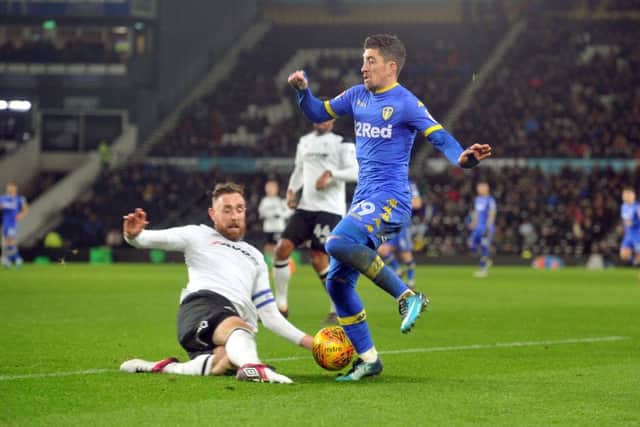 OVER THE TOP: Leeds United's Pablo Hernandez rides a tackle from Derby County's Richard Keogh.  Picture: Tony Johnson.