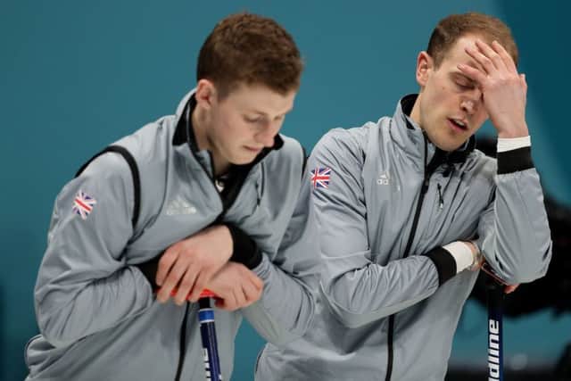 Great Britain's Kyle Smith and Thomas Muirhead show their frustration during their playoff match against Switzerland. Picture: David Davies/PA.