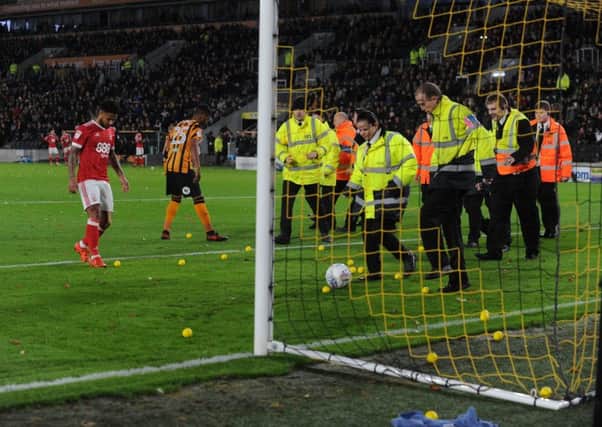 Play was held up when protesting Hull City fans lobbed hundreds of yellow balls onto the field during the clubs televised game with Nottingham Forest back in October (Picture: Bruce Rollinson).
