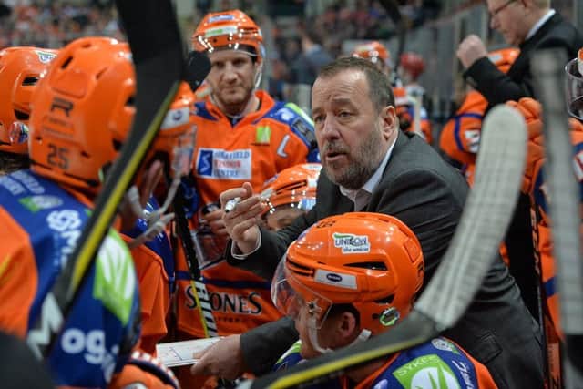 Sheffield Steelers' captain Jonathan Phillips, background, listens as head coach Paul Thompson gives instructions from the bench during Wednesday's defeat to Cardifdf Devils. Picture: Dean Woolley.
