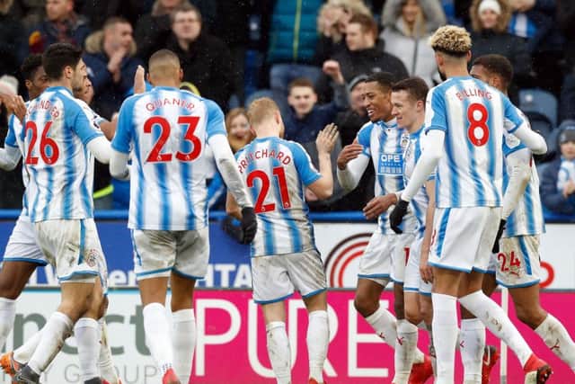 Huddersfield Town's Rajiv van la Parra celebrates with team-mates after scoring their final goal in the 4-1 win over Bournemouth (Picture: Martin Rickett/PA).